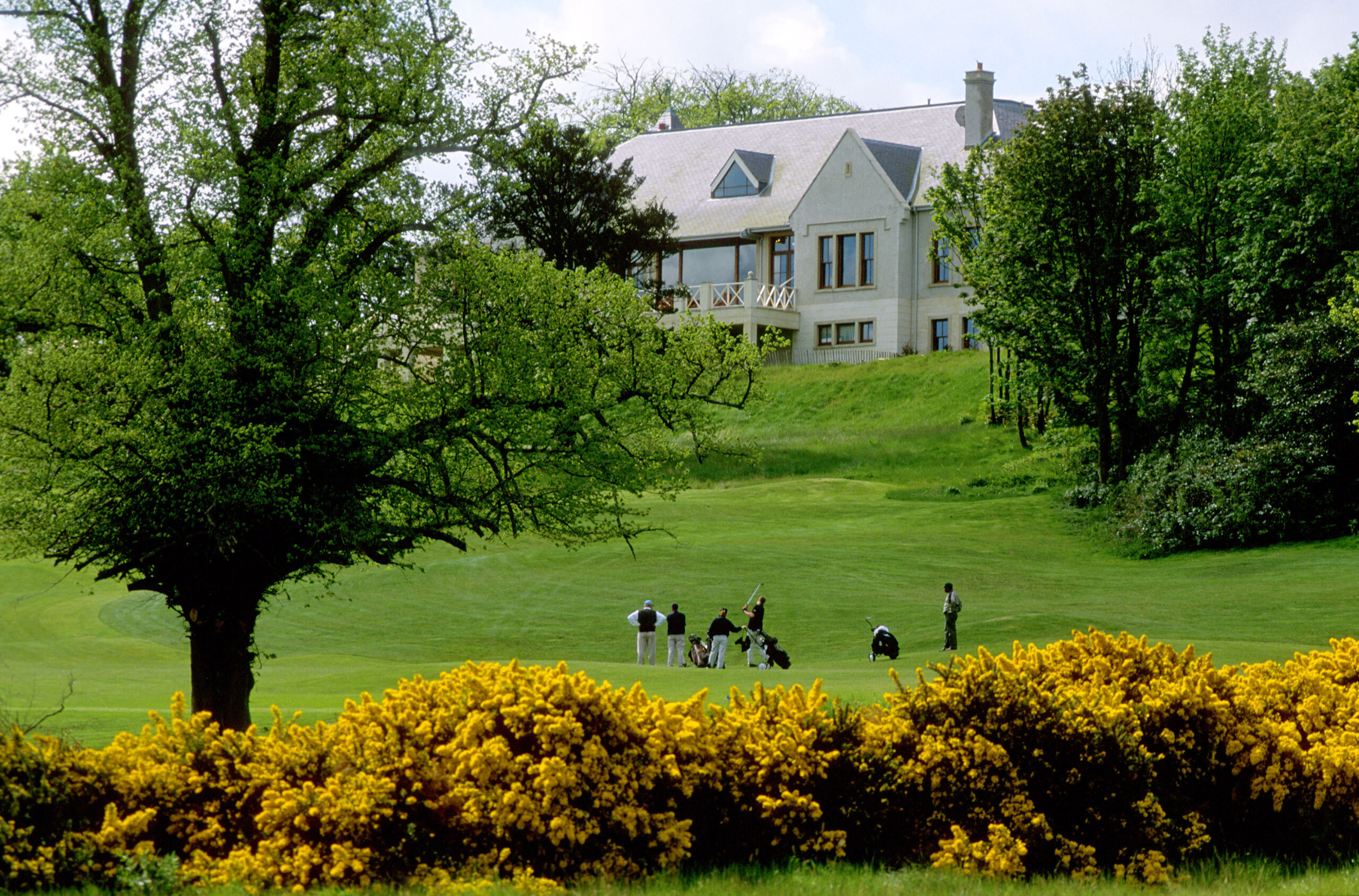 A view of some golfers at Dukes Golf course in Fife, Scotland.